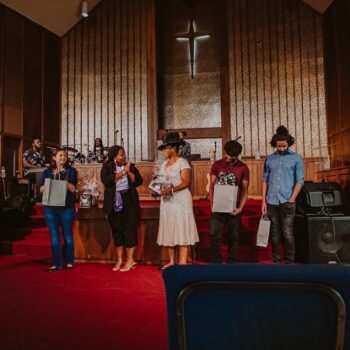 Group receiving gifts in church sanctuary