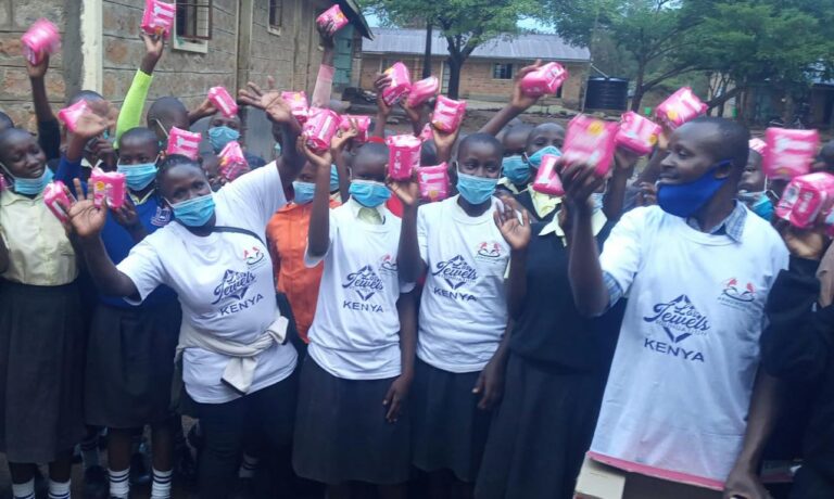 Masked schoolgirls holding pink packages